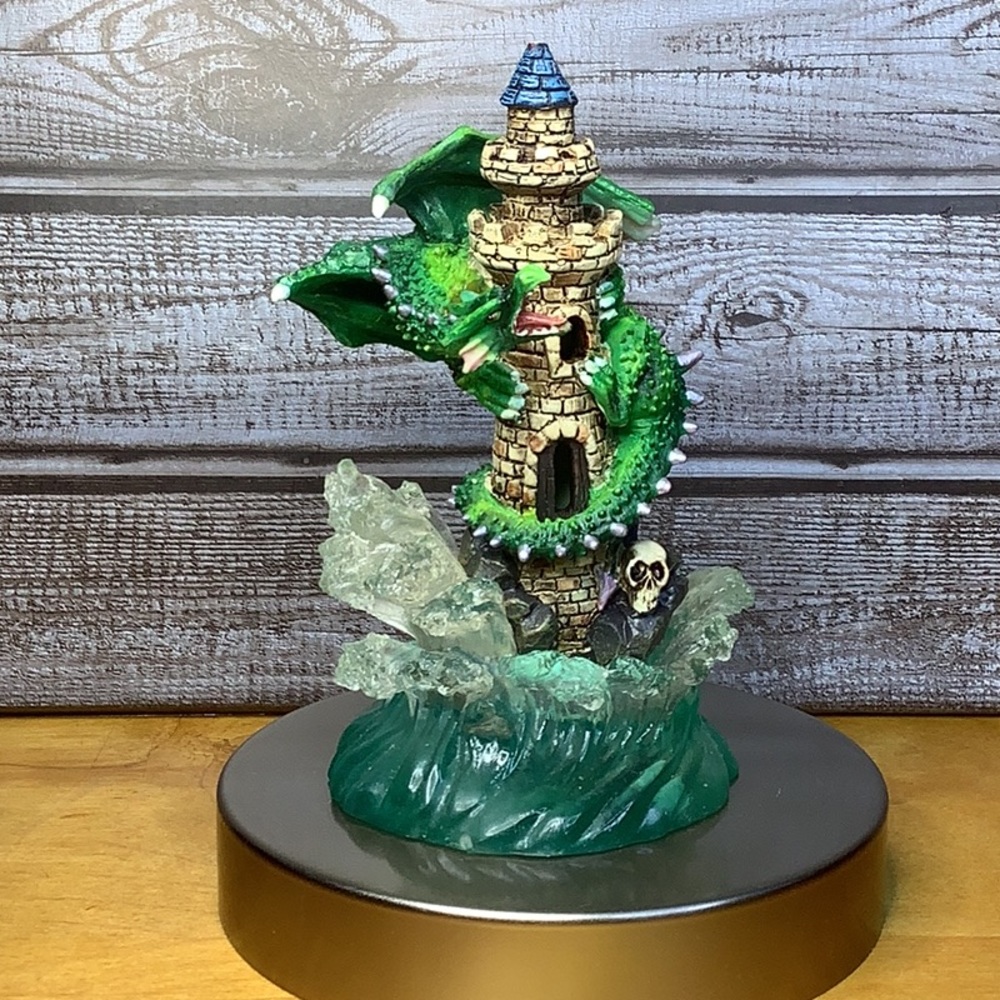 Small dragon resin statue with castle and waves